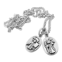 saint christopher medal and saint luke medal