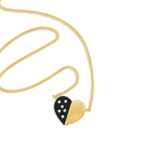 modern diamond heart necklace on thin gold curb link chain