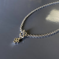 silver cross on a chain