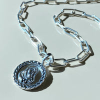 silver mother and child pendant