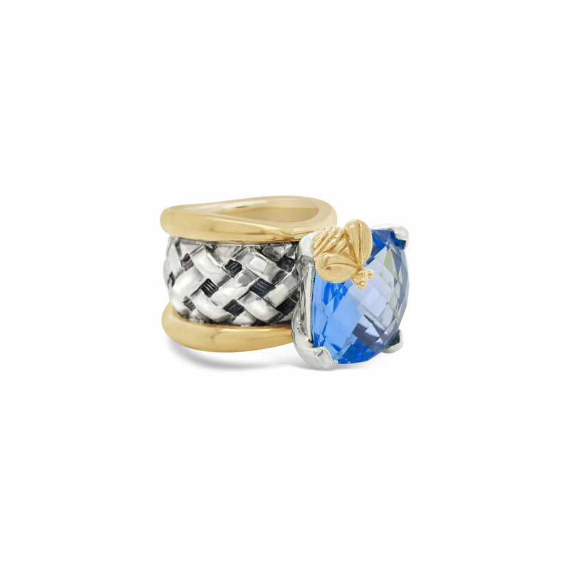 products/silver_ring_with_gold_rims_and_blue_topaz_stone.jpg