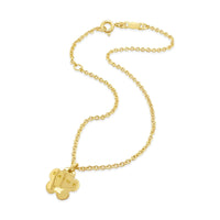 Gold bracelet with a flower-shaped pendant on a white background