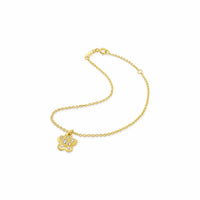 Gold bracelet with a flower charm on a white background