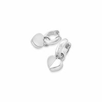 Silver heart-shaped charms on a white background