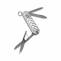 Swiss Army knife with a decorative pattern on a white background