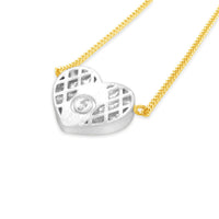 back view of diamond heart necklace on thin gold chain