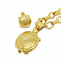 saint gold and diamond turtle necklace and ring