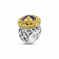 silver and gold ring with purple stone