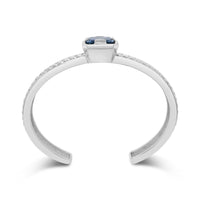 silver cuff bracelet with blue topaz stone